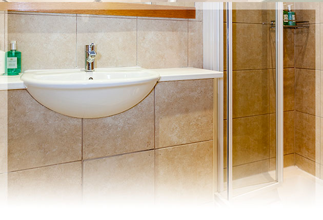 Relax in the beautifully appointed en-suite with walk in monsoon shower