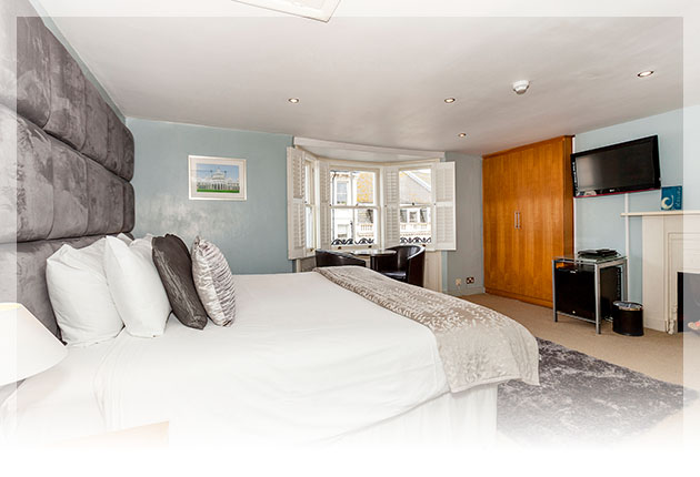 Modern super-king or twin beds, with stylish over-sized suede headboard
